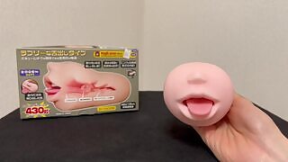 A Japanese boy attaches a mouth sex toy to a vacuum cleaner